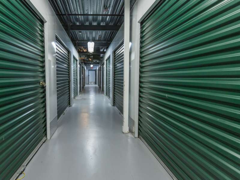 Storage doors. Building interior.Industrial storage in the city. Green doors.